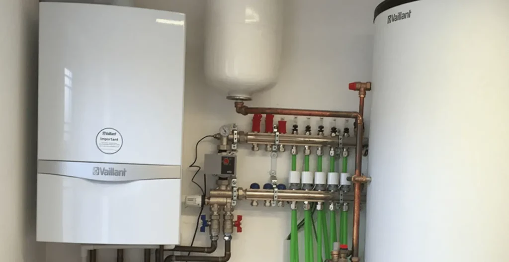 Vaillant boiler installed with underfloor heating manifold and hot water cylinder in a domestic property